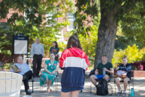 UMW sophomore Katia Savelyeva reads a chapter from emily m. danforth's 'The Miseducation of Cameron Post' at UMW's Banned Books Week Read Out on Wednesday. Photo by Matthew Binamira Sanders.