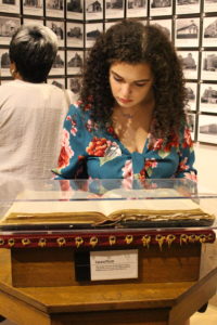 Jessica Lynch looks at a Bible from Bethel Baptist Church in Birmingham on the 2019 Freedom Rides trip sponsored by the James Farmer Multicultural Center. Photo by Lynda Allen.