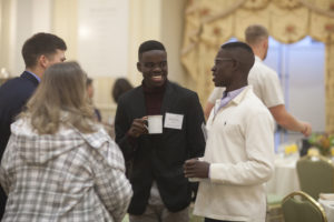 UMW senior Nehemia Abel (middle) and freshman Gadsoni Abel (right) mingle during the Executive-in-Residence breakfast, featuring speaker Pat Filippone '88. Photos by Karen Pearlman.UMW's College of Business Executive-in-Residence program exposes Mary Washington students to successful corporate leaders. Photos by Karen Pearlman.