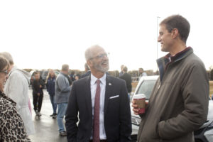 UMW President Troy Paino talks with Fredericksburg City Tourism Director Bill Freehling after Friday's ribbon cutting. The newly expanded parking lot at UMW's Battlefield Athletic Complex signifies a concerted effort of collaboration between UMW and the City of Fredericksburg. Photo by Karen Pearlman.