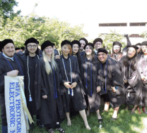 Tyler, with her grad school classmates, prepares to receive her MFA. At UMW, she switched focus, from biology to art, when a class she had with Professor Carole Garmon helped her realize she could make a paycheck while also pursuing her passion.