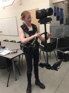 After receiving a bachelor's degree from UMW, Kyler went on to earn a master's in photographic and electronic media at the Maryland Institute College of Art. She is shown here in graduate school, flying a Steadicam.