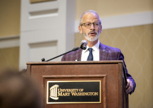 UMW President Troy Paino addresses the crowd. “If we continue to work together to commit ourselves to the ideals of justice, equality and service to our community," Paino said, "we are going to experience a better day.” Photo by Tom Rothenberg.
