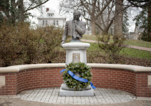 A wreath on the James Farmer bust on UMW's Campus Walk recognizes Farmer's 100th birthday and UMW's Farmer Legacy 2020 celebration. Photo by Tom Rothenberg.