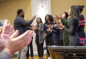 UMW's Voices of Praise sang Stevie Wonder's spirited version of 'Happy Birthday' for Dr. Farmer, while the audience clapped. Photo by Tom Rothenberg.