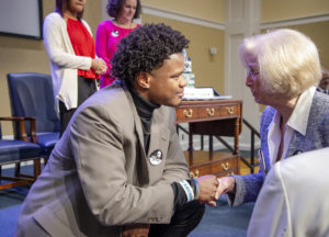 Student Government Association President Jason Ford with a Fredericksburg community member. Ford shared the impact that Farmer's life and legacy has had on him, and the words of wisdom that Rep. John Lewis gave him. Photo by Tom Rothenberg.