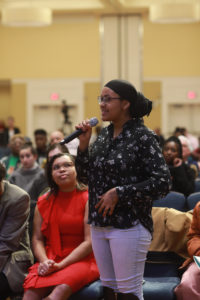 Bilqiis Sheikh-Issa, vice president of UMW's NAACP chapter asks a question during the Dr. Martin Luther King keynote address in January. Photo by Karen Pearlman.