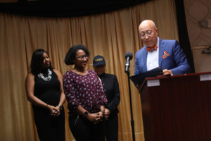 Xavier Richardson (right) presents a comendation to Kelsey Chavers '19 (center) and Brianna "Breezy" Reaves, two of the founding members of UMW's NAACP chapter. Reaves took over as chapter president when Chavers graduated in December.. Photo by Karen Pearlman.