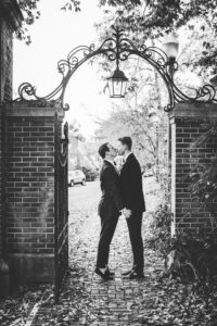 Evan Smallwood (left) and Aaron McPherson pucker up for photos on their wedding day. The two first met at the Eagle's Nest when Smallwood was a freshman and McPherson was a senior. They were married last year.