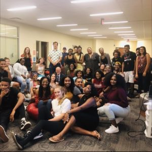 UMW President Troy Paino (middle, suit and tie) poses in the James Farmer Multicultural Center with members of UMW's new chapter of the NAACP. The chapter was chartered last May.