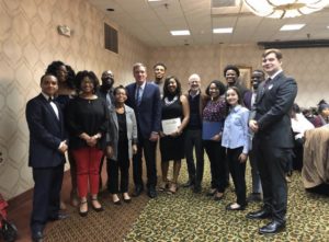 Members of UMW's NAACP chapter pose with Sen. Mark Warner at the Fredericksburg NAACP Branch MLK Breakfast. Photo by Karen Pearlman.