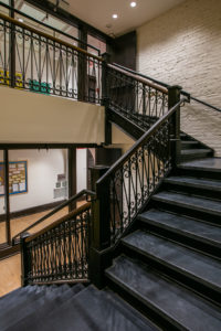 Original iron banisters and brick walls are among the details that were preserved in the recent Willard Hall renovation. Photo by Craig Hutson, Kjellstrom and Lee Construction.