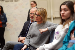 President Troy Paino and wife Kelly listen to Thomas as he shares his story about being pulled over by the police as a teen. He channeled his emotions about the incident into an original oratory, which he presented at regional and national competitions. Photo by Suzanne Carr Rossi.