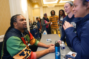 Thomas met with UMW students and college athletes after the program. Donning a hoodie emblazoned with Malcolm X's image, he said he often challenges stereotypes by trading in his suits and ties for hoodies, Timberland boots and jeans for speaking engagements, as he did recently when speaking to a police organization. They stopped paying attention to what Thomas was wearing and instead focused on what he was saying, he said. Photo by Suzanne Carr Rossi.
