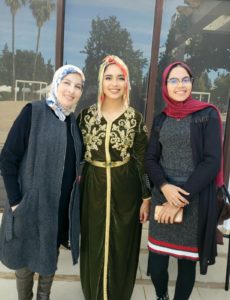 Amal Hajjami (center), on the day she was sworn in as a Peace Corps volunteer in Morocco, with Btissam Errifai (left), director of a local women's center where Hajjami works, and Zineb El Hani Provental (right), director of the Peace Corps' Youth in Development program in Morocco. Hajjami will spend the next two years teaching English, Spanish and life skills to Moroccan women and youth, and also teaches preschool at the women's center.