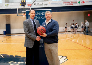 Seen here with head UMW men's basketball coach Marcus Kahn (right), Catullo received a bachelor's degree in psychology from Mary Washington in 1995.
