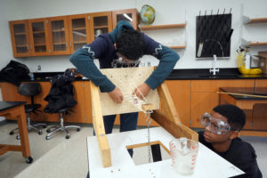 Amit Panchal, 16, (left) and Devyn Hopkins, 15, (right) of Fairfax High School work on their entry in the Boomilever competition. Saturday's Virginia Science Olympiad at UMW featured an array of competitions. Photos by Suzanne Carr Rossi.