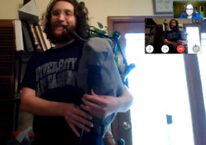 Lauren McMillan (top right corner), an assistant professor of historic preservation and UMW's Eagle Pipe Band director, teaches rising senior Matt Smith bagpipes over Skype.