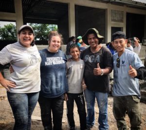 Students Helping Honduras co-founder Shin Fujiyama '07, with volunteers from UMW and local residents at a school site in Honduras. Thousands of volunteers have helped the nonprofit over the years, including many from his alma mater. Photo courtesy of SHH.