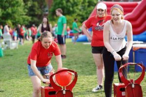 UMW students participate in a balloon-inflating competition during the 2019 Devil Goat Day celebration. Photo by Suzanne Carr Rossi.
