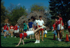 Students participate in a "wheelbarrow race" for Devil Goat Day on the lawn in front of Jefferson and Combs Halls in 1985. Photo courtesy of Simpson Library Special Collections.