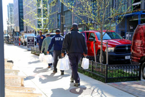 D.C. firefighters picking up Power of 10 meals from Bruner-Yang's restaurant, ABC Pony. Photo Credit: Foreign National.