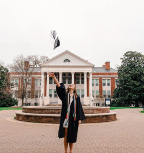 Class of 2020 graduate Camryn Molnar tosses her cap in front of Monroe Hall and the Palmieri Fountain. She's among the 1,309 UMW graduates who will participate in commencement in the fall. The combined undergraduate and graduate ceremony is currently scheduled for October 24. Photo credit: dpan.visuals on Instagram.