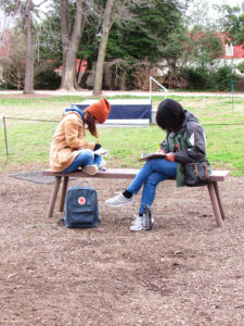 UMW students Beth Devine (left) and Chinnae Faustor (right) document tours outside George Washington's Mount Vernon.