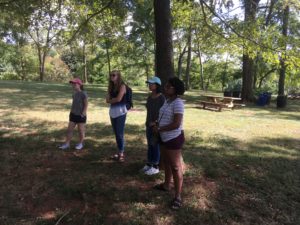 From left to right, UMW students Beth Devine, Kylie James, Chinnae Faustor and Kelsey Chavers stand outside Montpelier, the Orange County antebellum home of U.S. President James Madison. The students conducted research on how Southern plantation museums tell the story of slavery, under the guidance of Professor of Geography Steve Hanna, whose related journal article recently earned the prestigious Zumkehr Award.