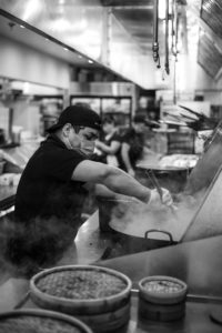 The kitchen team at Maketto, one of Bruner-Yang's restaurants, making Power of 10 meals. Photo Credit: Foreign National.