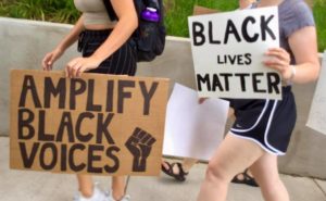 UMW students' signs illustrate their stance on systemic racism and Black Lives Matter.