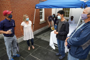 President Paino and wife Kelly chat with first-year student Adrian Lopez of Westmoreland County. Photo by Suzanne Rossi.