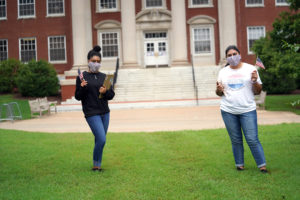 UMW students Maya Moore (L) and Stephanie Turcios (R) are helping their fellow Eagles participate in the upcoming presidential election. Tomorrow, Mary Washington will celebrate a safe, socially distanced National Voter Registration Day on Campus Walk. Photo by Suzanne Carr Rossi.