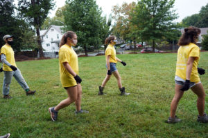 From left to right: Lance Whitesel, Faith Jones, Paige Beidelman and Brenna Creamer spread out and socially distanced while volunteering with Tree Fredericksburg. Photo by Suzanne Carr Rossi.