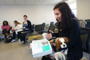 UMW senior Claudia Woods, president of the student club DiversAbility (and shown here in a psychology course with her service dog, Hero), is taking "Intro to Disability Studies." Offered for the first time this fall, the course takes an interdisciplinary look at disability as a concept as key to the human experience as race or gender. Photo by Suzanne Carr Rossi.