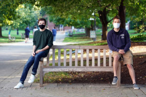 Young Democrats president Samuel Hartz (left) and College Republicans president Andrew Newman (right) may be on opposite sides of the aisle - or a Campus Walk bench - but their respective groups have often teamed up to organize debates with local candidates, as well as other political events that encourage the spirit of bipartisanship. Photo by Suzanne Carr Rossi.