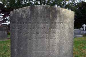 The grave of iron-worker William James Drinan, who was the first person to be buried in the City Cemetery in 1844. Legend has it that whoever is the first laid to rest in a graveyard becomes the guide for other souls who are buried there. Photo by Suzanne Carr Rossi.