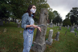 Freshman Eliza Vegas leads a "Graves and Ghouls" tour through the Fredericksburg City Cemetery earlier in October. The socially distanced tour replaced the Historic Preservation Club's popular Ghostwalk this year. Photo by Suzanne Carr Rossi.