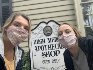 Kylie Jones (left) and Julia Crofford (right), both first-year UMW students, pose outside the Hugh Mercer Apothecary Shop in downtown Fredericksburg. UMW and the City are working together through a joint task force that aims to ensure students adhere to COVID-19 guidelines even off campus.