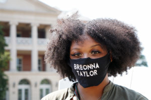 Brianna "Breezy" Reaves, president of UMW's NAACP chapter, is seen here wearing a mask with the name Breonna Taylor, a young Black woman who was fatally shot by police in her home, sparking nationwide protests. Reaves encouraged participants in Wednesday's forum to "do the work" of racial justice. Photo by Maria Schultz.