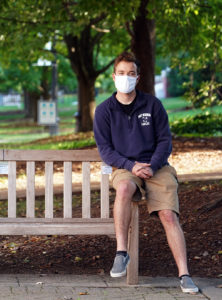 UMW sophomore Andrew Newman poses on a Campus Walk bench. The University community pulled together this fall to follow MMDC (monitor, mask, distance and clean) guidelines and minimize the number of COVID-19 cases on campus. Increased pandemic-related measures will be employed this spring.