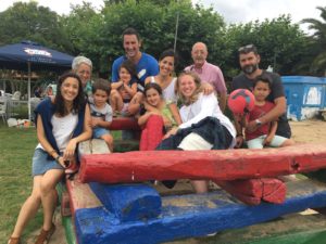 Chloe Morton (front row, second from right) with her host family from her study abroad experience in Bilbao; she returned the following summer to serve as an au pair for the family.