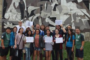 Thomas Peterson (back row, fourth from left) with his UMW classmates in front of a replica of Picasso's "Guernica" in Guernica, Spain, while attending the Universidad de Deusto in Bilbao in 2017.