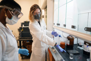 "When people think about chemistry, they often think of scientists in lab coats and goggles with smoking beakers as they are portrayed on TV and movies. It really is much more than that," said Smith, shown here, explaining to Ebenki, a UMW student, how to extract capsaicin and dihydrocapsaicin from Maltese's Signal One 2.0 beer. "Just about every single product we purchase has been subjected to chemistry to make sure it is safe and within set guidelines." Photo by Suzanne Carr Rossi.