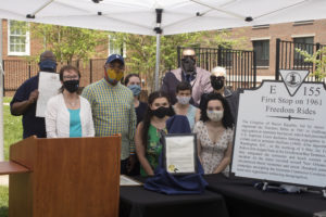 From left to right: JFMC Assistant Director Chris Williams, Mayor Mary Katherine Greenlaw, Delegate Joshua Cole, Professor Erin Devlin, UMW senior Jessica Lynch, Professor Christine Henry, Vice Mayor Chuck Frye, UMW junior Sydney Baylor and retired teacher Mayo Carter pose with the marker. Photo by Karen Pearlman.