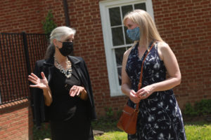 Retired teacher Mayo Carter (left), who paid for the historic marker, speaks with Sonja Cantu, public information officer for the City of Fredericksburg. Photo by Karen Pearlman.