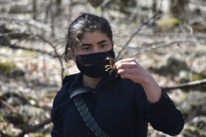 Liliana Ramirez examines a crayfish during one of the SMSC cohort's hikes in nearby Shenandoah National Park. Photo Credit: Smithsonian-Mason School of Conservation.