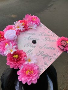 The message on Spanish major Sandra Vasquez's cap translates to: "Sometimes I cried. Sometimes I doubted. But I never gave up!"