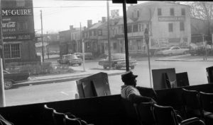 A man sits inside Fredericksburg's bus depot in 1965. The nearby Hotel McGuire and Rappahannock Hotel were listed in the Green Book, a guide that helped Black travelers find safe accommodations. Photo credit: File / The Free Lance-Star.
