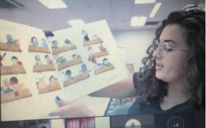 Incorporating culturally responsive teaching practices into her curriculum, Carr reads books representative of her students' diverse backgrounds. Here, she reads Alexandra Penfold's "All Are Welcome" to her kindergartners on the first day of virtual school last fall.